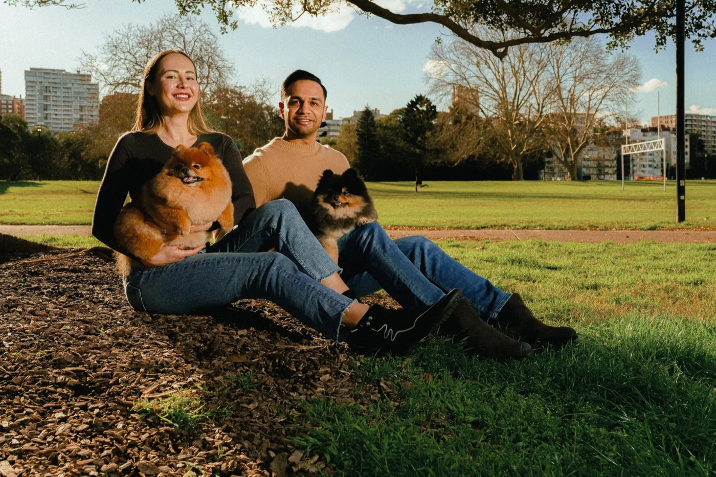 The Wellaroo family — two humans with their Pomeranians Tyson and Tami